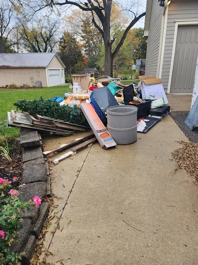 Dumpster being loaded with debris for Residential Dumpster Rental in Annetta